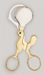 Ciseau coupe oeufs dore en forme de poussin